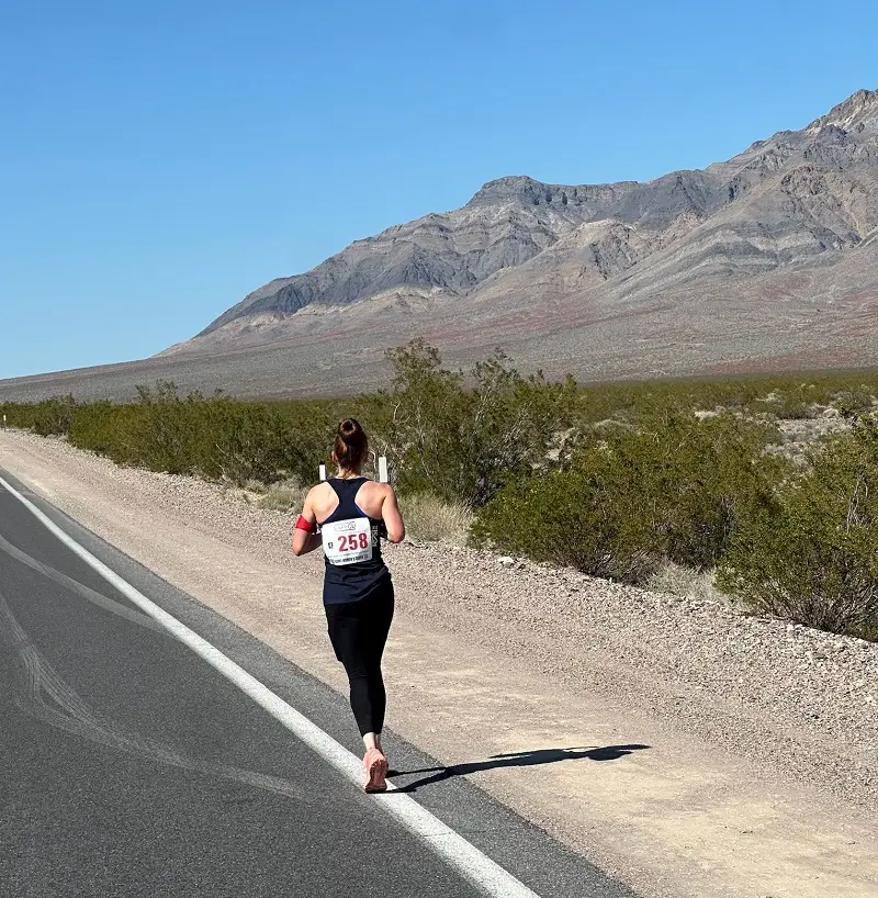 A U.S. Marshals Service member running the race in 2025